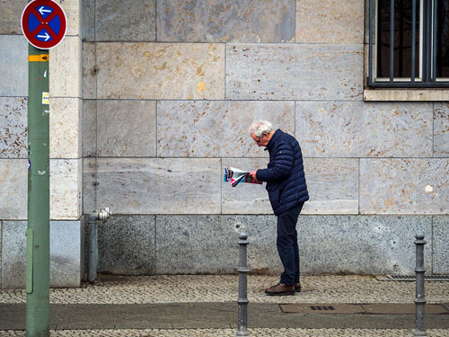 man reading on the street